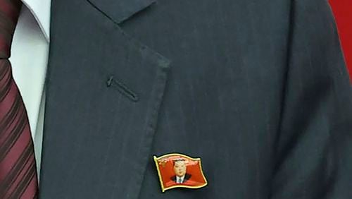 This photo provided Monday, July 1, 2024, by the North Korean government shows that a senior official wears lapel pins with the image of Kim Jong Un during a ruling party’s meeting in Pyongyang Sunday, June 30, 2024. Independent journalists were not given access to cover the event depicted in this image distributed by the North Korean government. The content of this image is as provided and cannot be independently verified. (Korean Central News Agency/Korea News Service via AP)