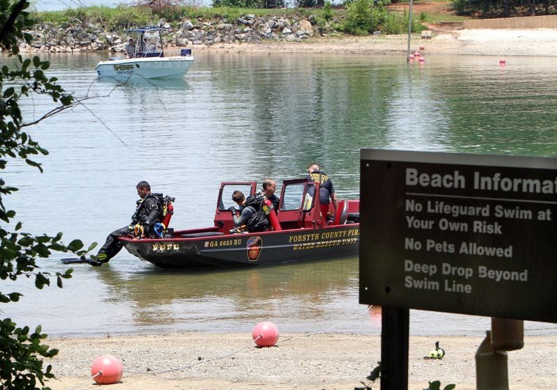 Drownings can happen to adults and children, especially this time of year. In this file photo, Forsyth County divers prepare to search in the swimming area of Buford Dam Park on Lake Lanier for an apparent drowning victim. AJC FILE PHOTO 2011