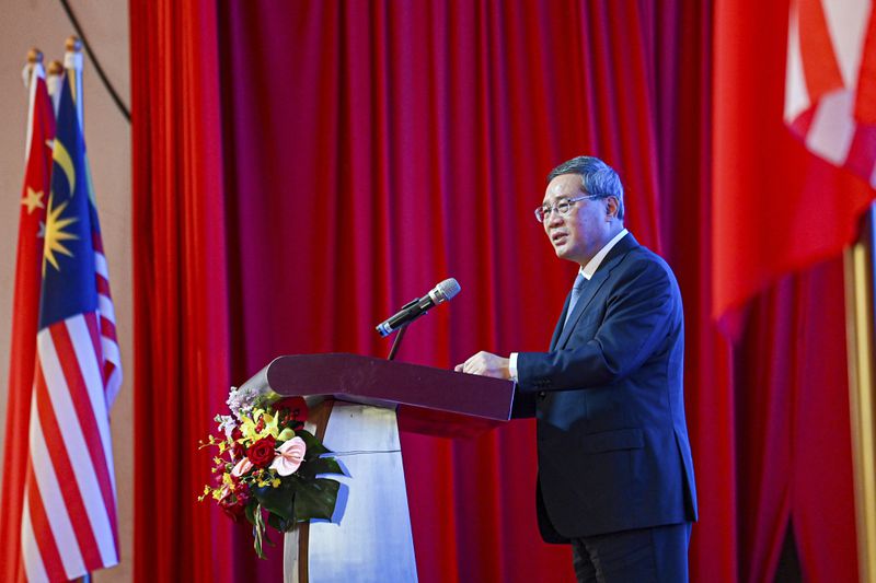 In this photo released by Malaysia's Department of Information, China's Premier Li speaks during business luncheon with Malaysian Prime Minister Anwar Ibrahim at a hotel in Kuala Lumpur, Malaysia, Thursday, June 20, 2024. (Malaysia's Department of Information via AP)