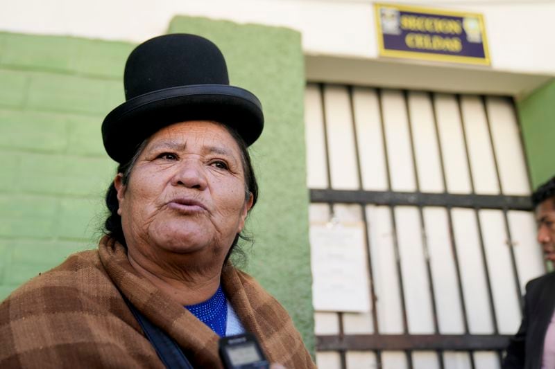 Satusa Apaza stands outside the jail where a relative of hers is being held in connection with his alleged involvement in what President Luis Arce called a coup attempt in La Paz, Bolivia, Friday, June 28, 2024. (AP Photo/Juan Karita)