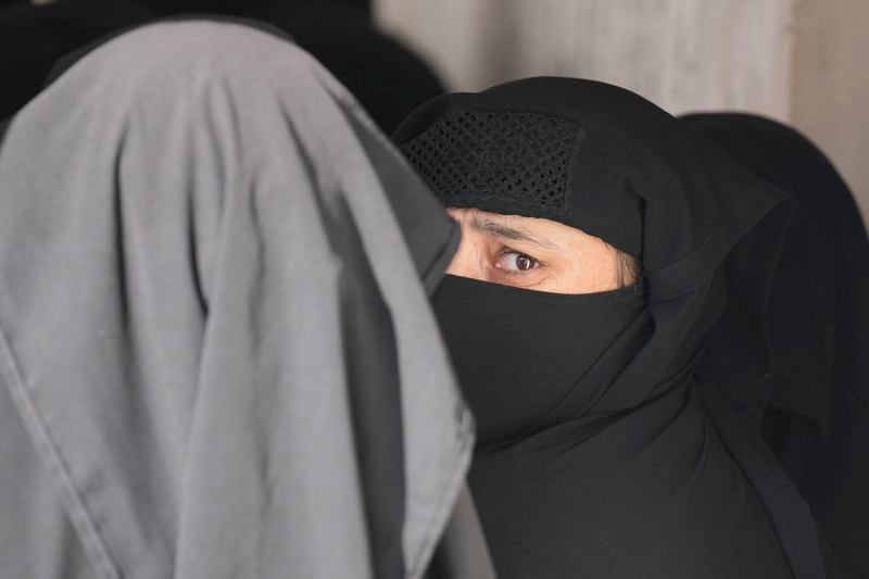 Muslim women voter queue up to cast their vote at a polling booth during the first phase of the Jammu and Kashmir assembly election, in Kishtwar, India, Wednesday, Sept. 18, 2024. (AP Photo/Channi Anand)