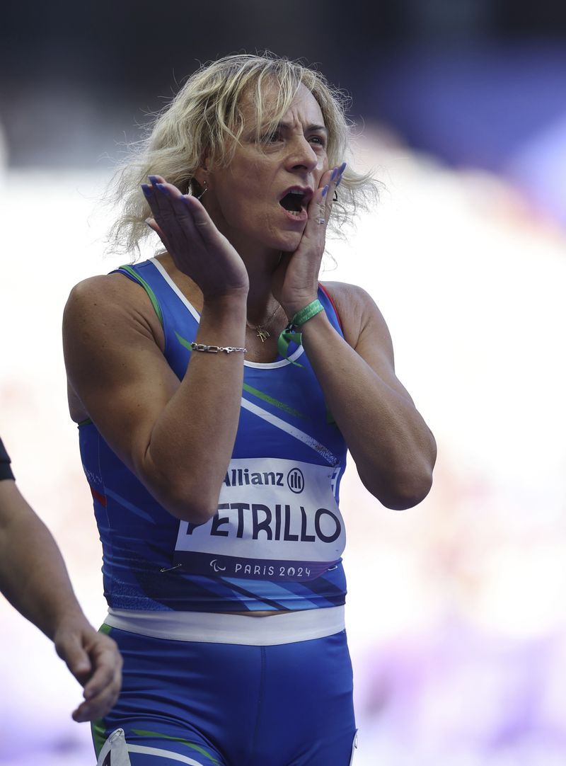 Italy's Valentina Petrillo reacts as she prepares to compete in the women's 400m T12 round 1, at the Stade de France Stadium, during the 2024 Paralympics, Monday, Sept. 2, 2024, in Paris, France. (AP Photo/Jackson Ranger)