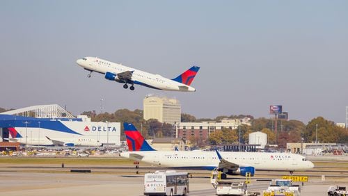 Delta airplanes are seen departing and arriving at the  Hartsfiedl-Jackson Atlanta International Airport on Wednesday, Nov. 8, 2023.
Miguel Martinez /miguel.martinezjimenez@ajc.com