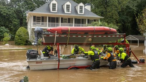 Atlanta Fire Rescue’s Dive/Swift Water Team performed welfare checks on residents on Hanover West Drive in Atlanta on Friday, Sept. 27, 2024, after Hurricane Helene caused major flooding in parts of Atlanta. (John Spink/AJC)