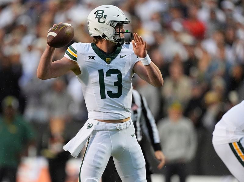 Baylor quarterback Sawyer Robertson drops back to pass in the first half of an NCAA college football game against Colorado, Saturday, Sept. 21, 2024, in Boulder, Colo. (AP Photo/David Zalubowski)