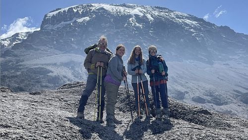 From left, James and Christy Howard stand for a photo with their daughters, Gracie and Lucy. Christy Howard, a 50-year-old Chattanoogan with epilepsy, and her family climbed Mount Kilimanjaro in July. (Contributed photo)