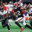 Atlanta Falcons wide receiver KhaDarel Hodge (12) is chased after breaking away during overtime of an NFL football game against the Tampa Bay Buccaneers on Thursday, October 3, 2024, at Mercedes-Benz Stadium in Atlanta. 
(Miguel Martinez/ AJC)