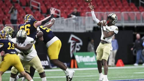 Swainsboro's Demello Jones attempts a pass against Prince Avenue Christian in the Class A Division I GHSA State Championship game at Mercedes-Benz Stadium, Monday, December. 11, 2023. (Jason Getz / Jason.Getz@ajc.com)