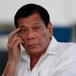 FILE -Philippine President Rodrigo Duterte listens to a question from reporters at Manila's International Airport, Philippines on, Nov. 9, 2016. (AP Photo/Aaron Favila, File)