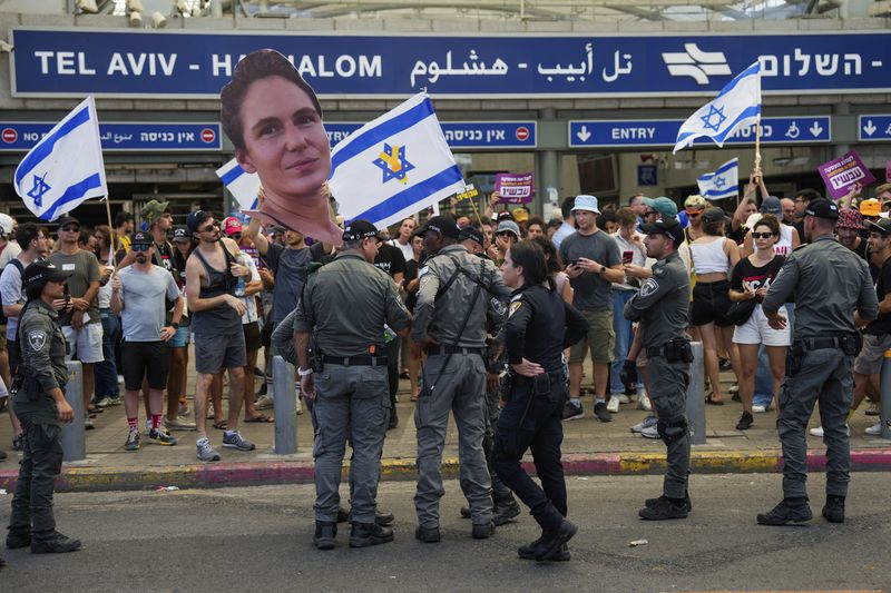 Demonstrators demand a cease-fire deal and the immediate release of hostages held by Hamas in the Gaza Strip after the deaths of six hostages in the Palestinian territory, in Tel Aviv, Israel, on Monday, Sept. 2, 2024. (AP Photo/Ohad Zwigenberg)