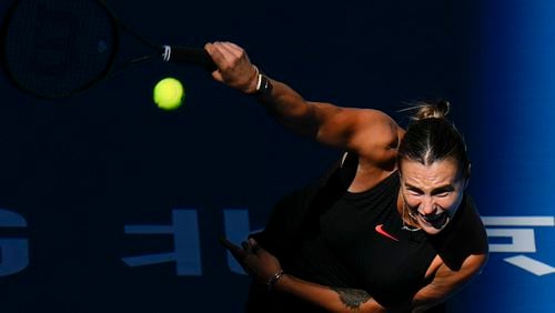 Aryna Sabalenka of Belarus serves against Madison Keys of the United States during their women's singles match of the China Open tennis tournament, at the National Tennis Center in Beijing, Wednesday, Oct. 2, 2024. (AP Photo/Andy Wong)