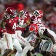 Alabama quarterback Jalen Milroe (4) attempts a pass as Georgia linebacker CJ Allen (3) pressures Milroe during the second half at Bryant-Denny Stadium, Saturday, Sept. 28, 2024, in Tuscaloosa, Al. Alabama won 41-34. (Jason Getz / AJC)

