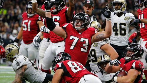 Atlanta Falcons tackle Ryan Schraeder (73) reacts to the official on a score by Tevin Coleman, behind Schraeder, in the first half of an NFL football game against the Atlanta Falcons in New Orleans, Monday, Sept. 26, 2016. (AP Photo/Butch Dill)