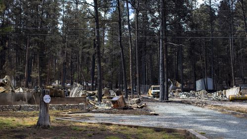 Houses destroyed by the South Fork Fire are pictured in the mountain village of Ruidoso, N.M., Saturday, June 22, 2024. . (AP Photo/Andres Leighton)