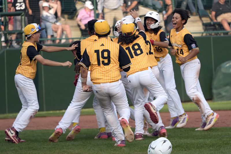 Lake Mary, Fla. celebrates their 2-1 against Taiwan during the Little League World Series Championship game in South Williamsport, Pa., Sunday, Aug. 25, 2024. (AP Photo/Tom E. Puskar)