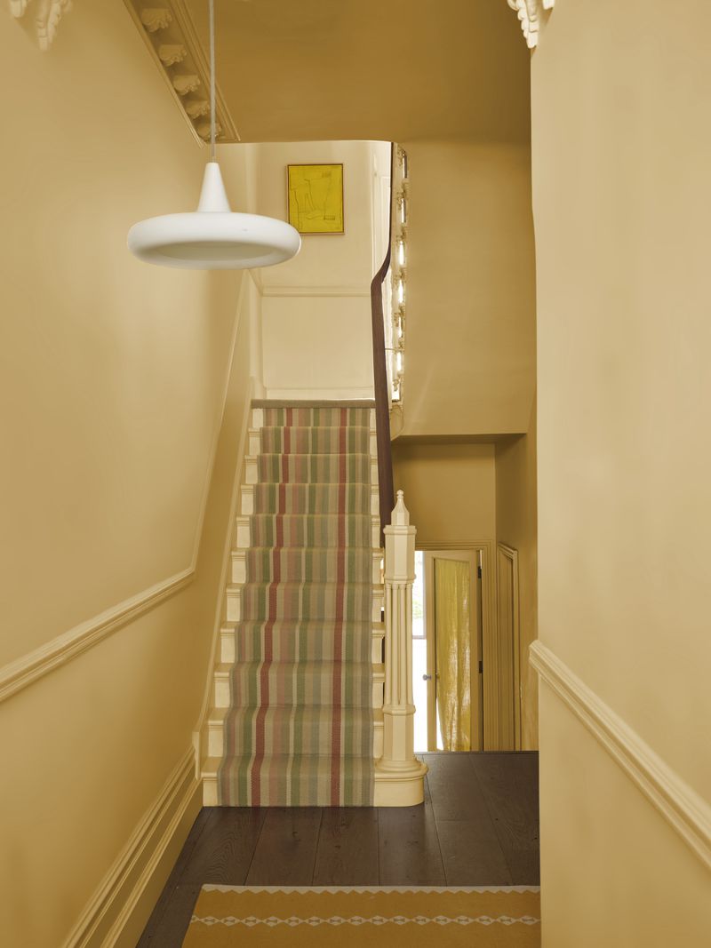 A color-drenched hall in Farrow & Ball's Sudbury Yellow.
(Courtesy of Farrow & Ball)