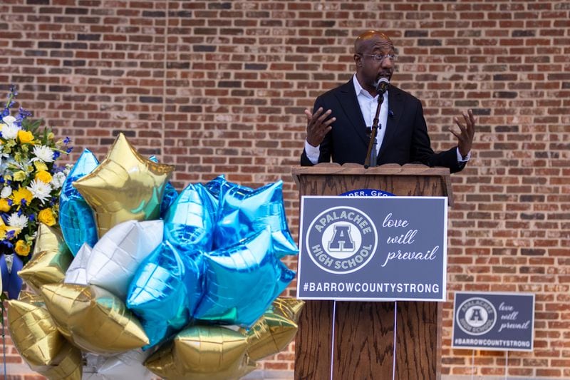 U.S. Sen. Raphael Warnock, an Atlanta Democrat, speaks at a vigil in Winder for the four victims fatally shot at Apalachee High School last week.