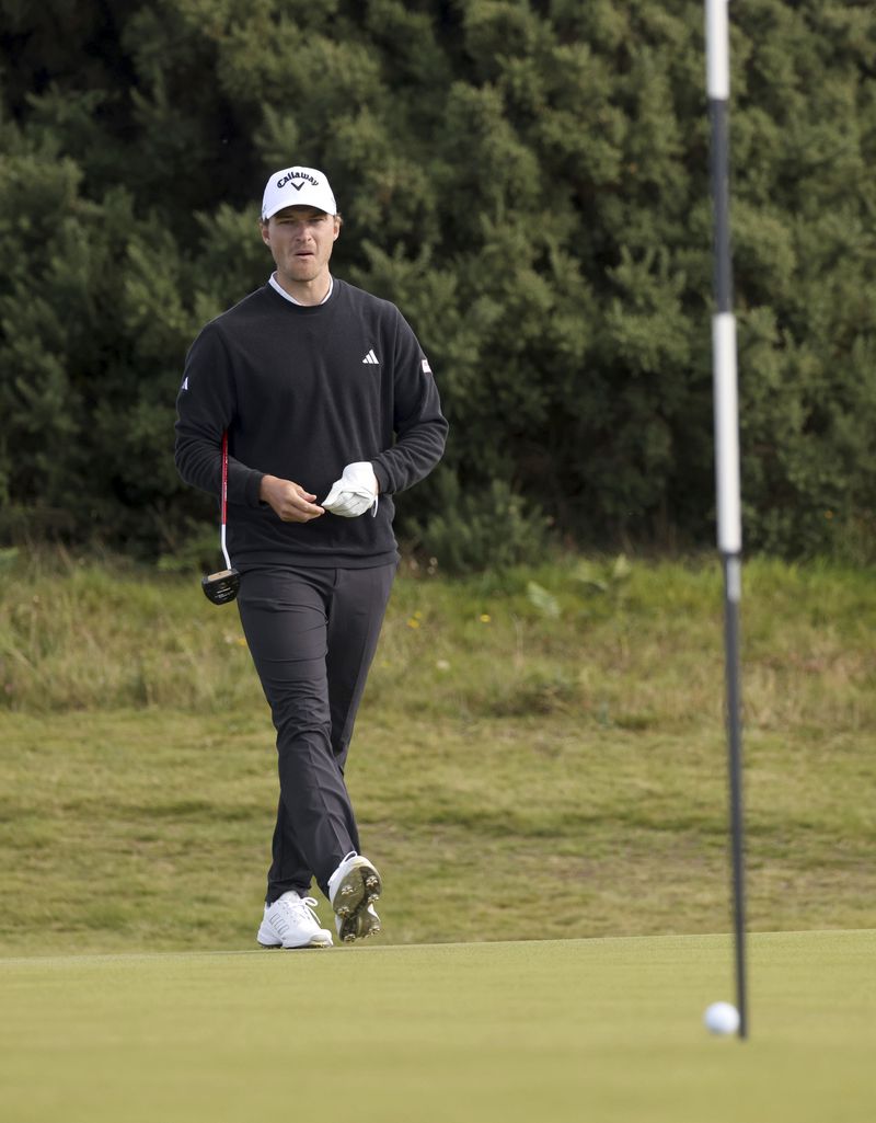 Denmark's Rasmus Hojgaard putting on the sixteenth green during day four of the Amgen Irish Open 2024 at Royal County Down in Newcastle, County Down, England, Sunday Sept. 15, 2024. (Peter Morrison/PA via AP)