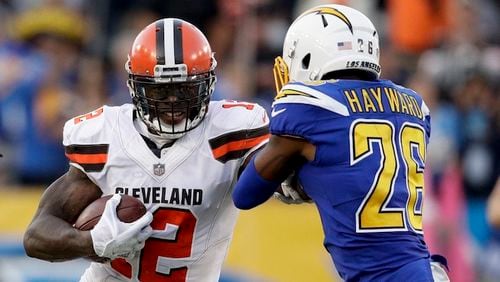 Browns wide receiver Josh Gordon runs against Chargers cornerback Casey Hayward. Hayward agreed to a two-year contract with the Falcons, according to NFL Media. His agent confirmed the report. (AP Photo/Jae C. Hong)