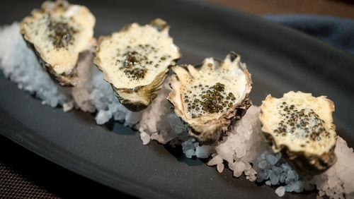 To get in the spirit of Valentine’s Day, consider roasted oysters with Champagne “avgolemono” and Russian Ossetra caviar at Kyma. CONTRIBUTED BY MIA YAKEL