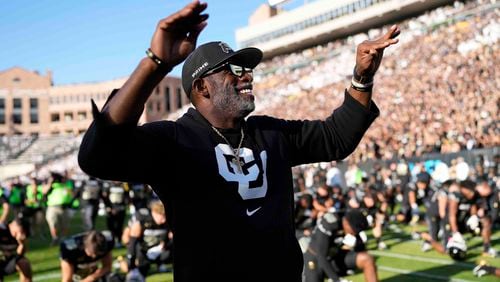 Colorado head coach Deion Sanders conducts fans before an NCAA college football game against North Dakota State, Thursday, Aug. 29, 2024, in Boulder, Colo. (AP Photo/Jack Dempsey)