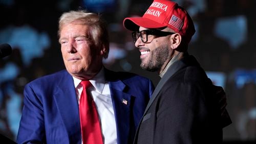 Republican presidential nominee former President Donald Trump, left, greets Nicky Jam during a campaign event at the World Market Center, Friday, Sept.13, 2024, in Las Vegas. (AP Photo/Alex Brandon)