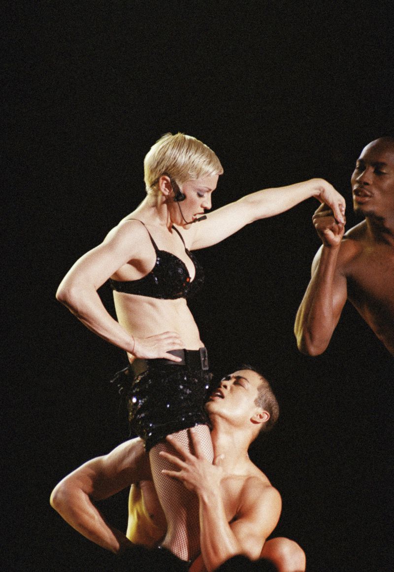 FILE - American pop star Madonna performs "Fever" in her 1993 Girlie Show World Tour concert before 30,000 fans at the Tokyo Dome, Japan, Dec. 13, 1993. (AP Photo/Koji Sasahara, File)