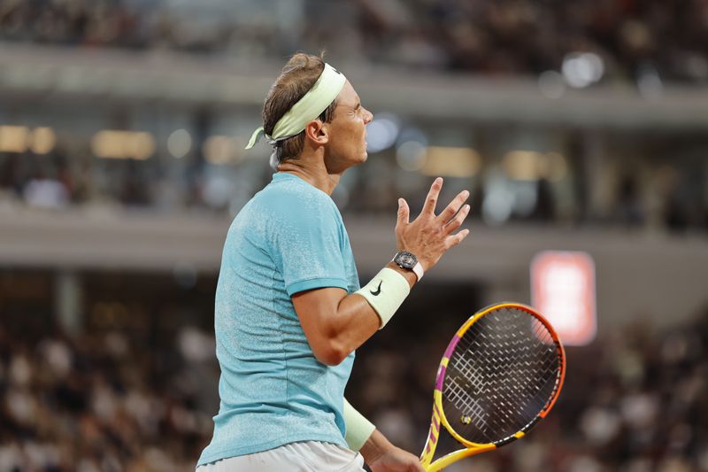 Spain's Rafael Nadal gestures after missing a shot against Germany's Alexander Zverev during their first round match of the French Open tennis tournament at the Roland Garros stadium in Paris, Monday, May 27, 2024. (AP Photo/Jean-Francois Badias)