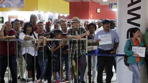 A crowd waits for arriving passengers to clear through customs at Jose Marti International Airport in Havana. Delta launched its first scheduled airline flights to Cuba on Dec. 1, a key milestone in the U.S. opening to Cuba. The Dec. 1 launch of the Atlanta-Havana route opens local travel to Cuba. BOB ANDRES /BANDRES@AJC.COM