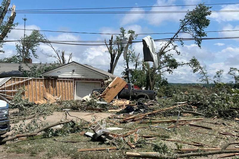This photo provided by the New York State Police, shows severe weather damage to a home and power lines in Eden, N.Y., Wednesday, July 10, 2024. (New York State Police via AP)