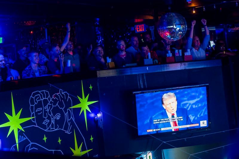 Attendees cheer and laugh as Republican presidential nominee former President Donald Trump mentions Seattle during a debate against Democratic presidential nominee Vice President Kamala Harris at a watch party at Massive, a queer nightclub, Tuesday, Sept. 10, 2024, in Seattle. (AP Photo/Lindsey Wasson)