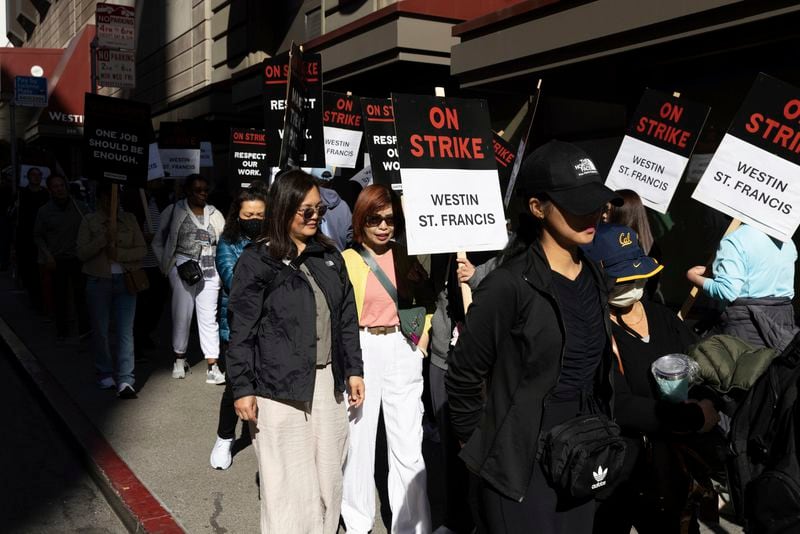 Hotel workers picket outside the Westin St. Francis Monday, Sept. 2, 2024, in San Francisco. (AP Photo/Benjamin Fanjoy)