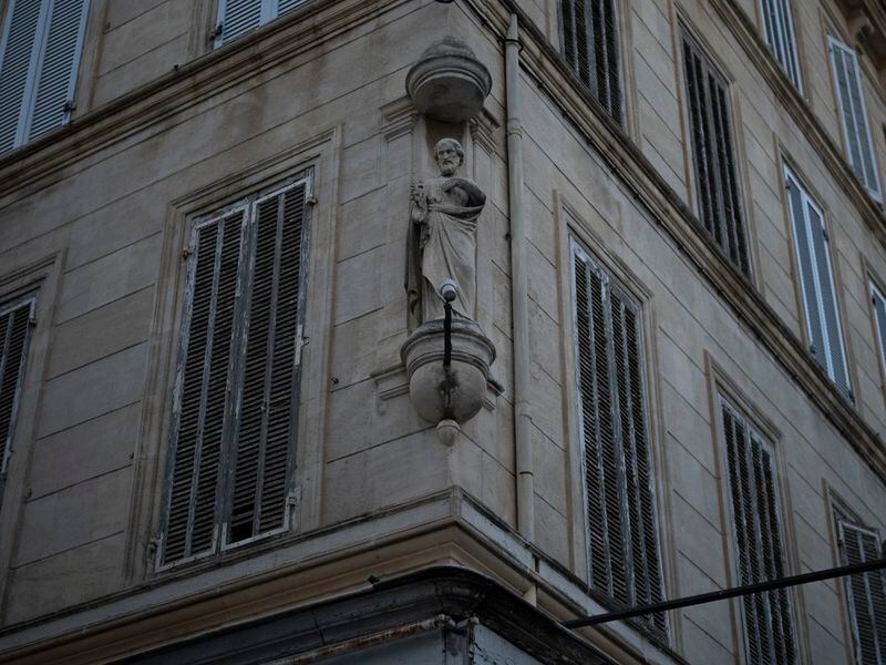 A Catholic religious icon is displayed on the corner of a building in the center of Marseille, southern France, Saturday, April 20, 2024. (AP Photo/Daniel Cole)
