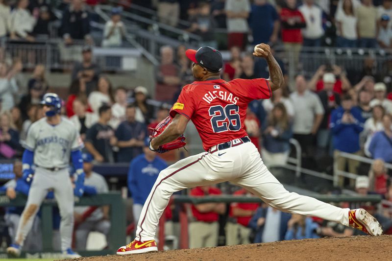 Atlanta Braves pitcher Raisel Iglesias throws in the ninth inning of a baseball game against the Kansas City Royals, Friday, Sept. 27, 2024, in Atlanta. (AP Photo/Jason Allen)