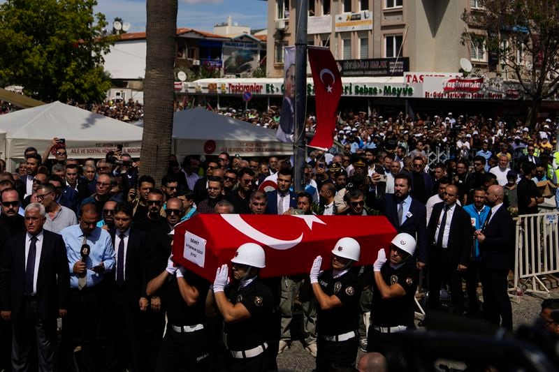 Turkish military police carry the body of Aysenur Ezgi Eygi, 26 year-old Turkish-American activist killed by the Israeli military, for the funeral prayer outside the central mosque of City of Didim, Turkey, Saturday, Sept. 14, 2024. (AP Photo/Khalil Hamra)