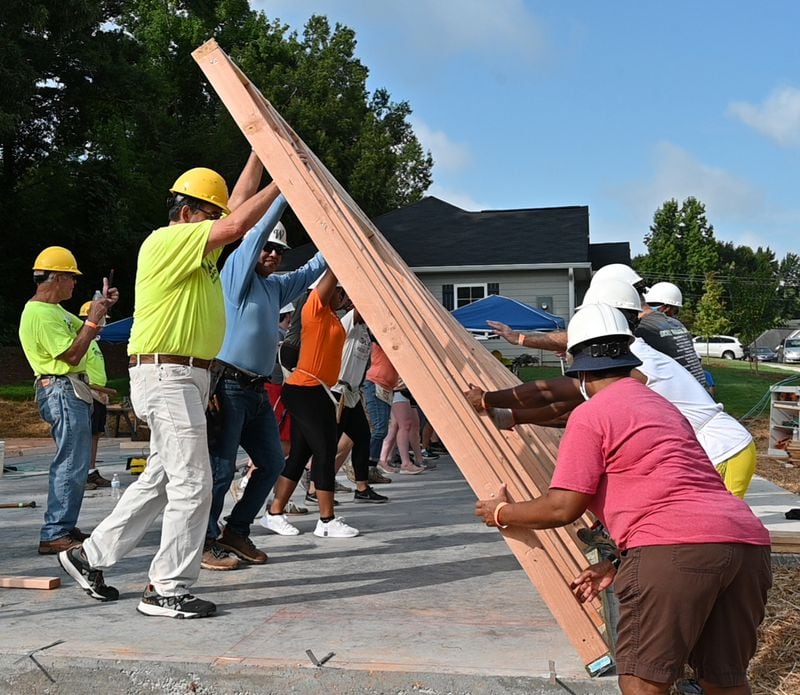 Volunteers raise the first wall for a Habitat home being built in an all-veterans neighborhood in Douglasville. Photo by Dolly Purvis/Habitat for Humanity of Northwest Metro Atlanta