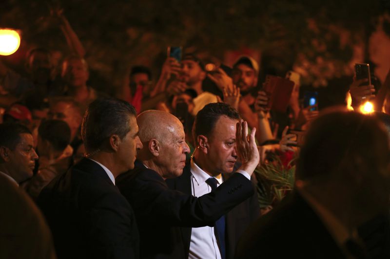 Tunisian president and candidate for re-election Kais Saied joins his supporters after the announcement of the provisional results for the presidential elections, in the capital Tunis, Tunisia, Sunday, Oct. 6, 2024. (AP Photo/Anis Mili)