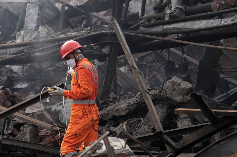A National Disaster Response Force rescuer works at the site after an explosion and fire at a chemical factory in Dombivali near Mumbai, India, Friday, May 24, 2024. Multiple people were killed and dozens were injured in the incident that happened Thursday. (AP Photo/Rajanish Kakade)