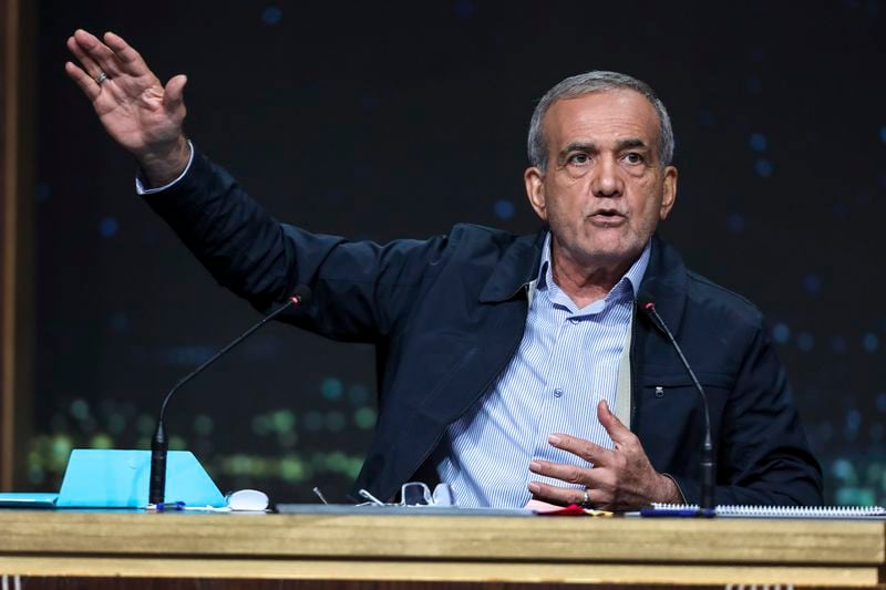 In this picture made available by Iranian state-run TV, IRIB, reformist presidential candidate for June 28, election Masoud Pezeshkian speaks in a debate of the candidates at the TV studio in Tehran, Iran, Thursday, June 20, 2024. (Morteza Fakhri Nezhad/IRIB via AP)