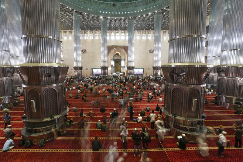 Muslim men leave after Friday prayers at Istiqlal Mosque in Jakarta, Indonesia, Friday, Aug. 9, 2024. (AP Photo/Tatan Syuflana)