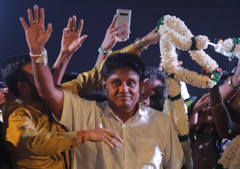 Sri Lankan presidential candidate Sajith Premadasa waves to his supporters during an election campaign rally in Negombo, Sri Lanka, Monday, Nov. 11, 2019. (AP Photo/Eranga Jayawardena, File)