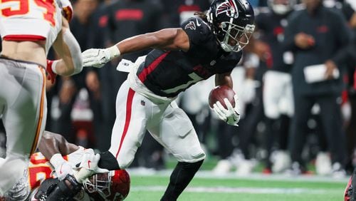 Atlanta Falcons running back Bijan Robinson (7) is tackled for a loss by Kansas City Chiefs linebacker Nick Bolton (32) for no gain on the fourth-and-1 play that ended the Falcons possession during the fourth quarter at Mercedes-Benz Stadium, Sunday, Sept. 22, 2024, in Atlanta. The Falcons lost 22-17. (Jason Getz / AJC)