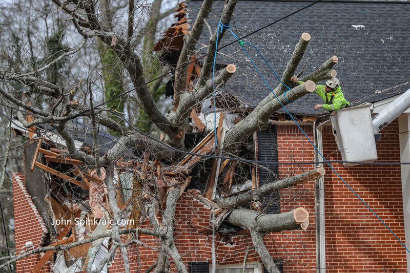 Strong winds on Wednesday afternoon brought down a tree on an apartment building at The Columns at East Hill in Decatur.
