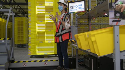09/01/2020 - Stone Mountain, Georgia -  Amazon contract department engineer Catherine Bourg explains how the Amazon Robots will assist in fulfilling customers orders during a first look tour of AmazonÕs ATL2 Fulfillment Center in Stone Mountain, Tuesday, September 1, 2020. (Alyssa Pointer / Alyssa.Pointer@ajc.com)