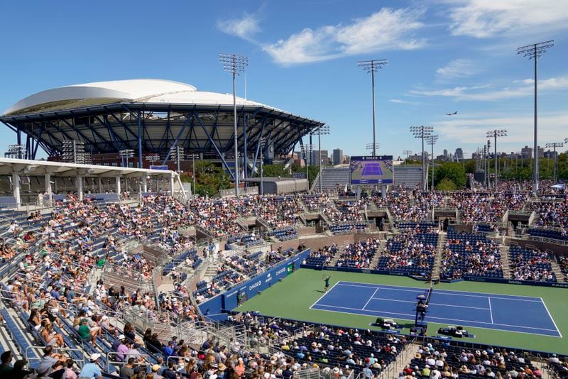 John Isner, of the United States, returns a shot to Michael Mmoh, of the United States, during the second round of the U.S. Open tennis championships, Thursday, Aug. 31, 2023, in New York. The 2024 U.S. Open begins Monday, Aug. 26. (AP Photo/John Minchillo, File)