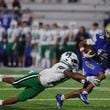 McEachern’s Zavion Harris (14) runs the ball during a NCAA High School football game between Harrison High School and McEachern High School at McEachern High School in  Powder Springs, GA., on Friday, October 4, 2024. (Photo/Jenn Finch, AJC)