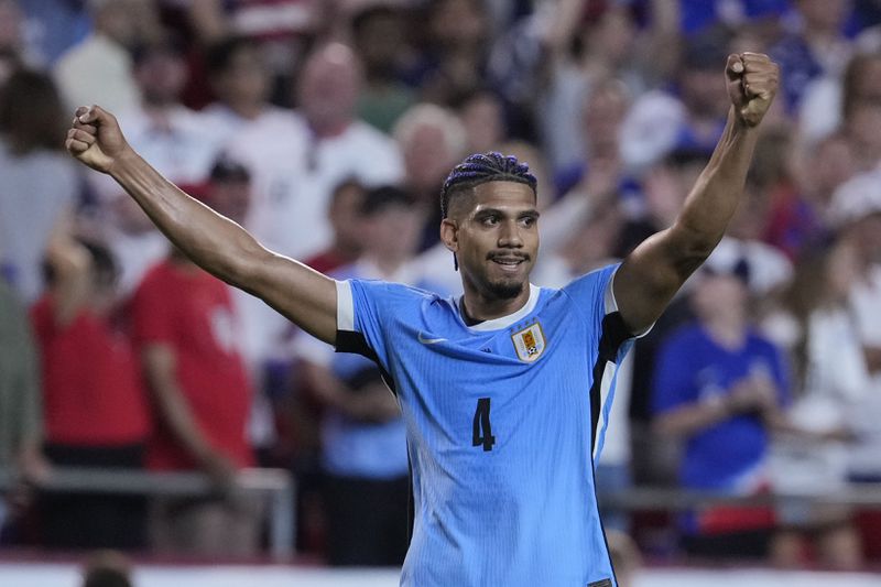 Uruguay's Ronald Araujo celebrates after Uruguay defeated the United States in an Copa America Group C soccer match, Monday, July 1, 2024, in Kansas City, Mo. (AP Photo/Ed Zurga)