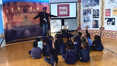 Fox in a Box teaching assistant Nicole Davis brings arts lessons to students at the Mohammed Schools of Atlanta. Courtesy