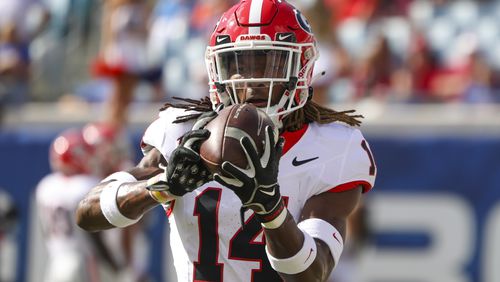 Georgia defensive back David Daniel-Sisavanh (14) warms-up before their game against Florida at EverBank Stadium, Saturday, October 27, 2023, in Jacksonville, Fl. Georgia won 43-20 against Florida. (Jason Getz / Jason.Getz@ajc.com)