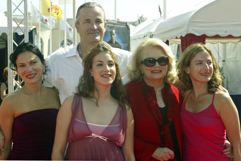 FILE - U.S. director Nick Cassavetes, son of director John Cassavetes, center back, poses with his sister Xan Cassavetes, from left, his daughter Gena Cassavetes, his mother Gena Rowlands, and his sister Zoe, before the screening of his film "The Notebook" on Sept. 5, 2004, at the 30th American film Festival of Deauville, in Normandy. (AP Photo/Franck Prevel, File)